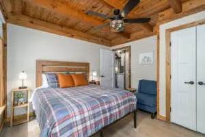 Time for some sleep? Our first main floor bedroom has a queen bed, coffee maker, reading chair, alarm clock, ceiling fan, smart tv, Echo speaker, and flashlights at the ready