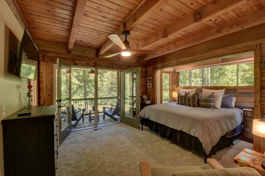 Our main level master bedroom is an escape to paradise. With an ensuite bath, large french doors with hideaway screens, balcony, and all our luxury amenities you won't want to leave. TV, coffee maker, flashlights, Echo speaker, reading chair
