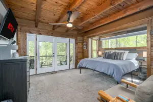 Our main level master bedroom is an escape to paradise. With an ensuite bath, large french doors with hideaway screens, balcony, and all our luxury amenities you won't want to leave. TV, coffee maker, flashlights, Echo speaker, reading chair