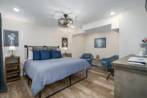 Our terrace level master bedroom has a king bed, two comfortable chairs for relaxing, TV, coffee maker, ceiling fan, flashlights, Echo speaker. All you need to escape and relax