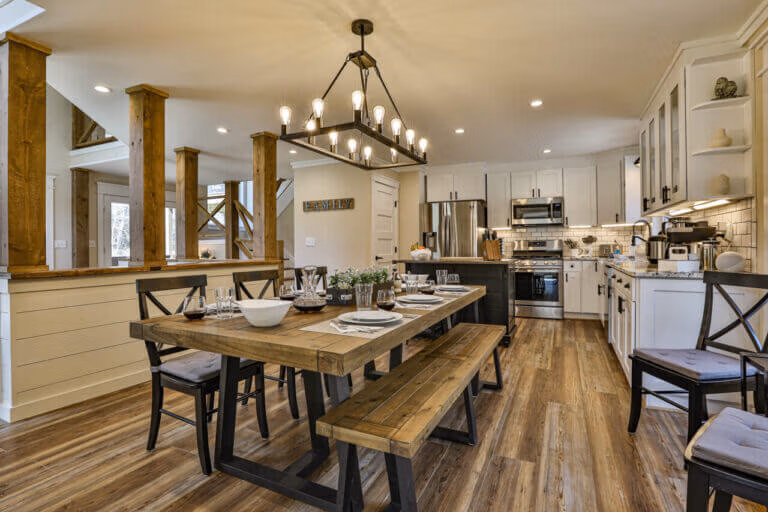 Spacious dining area with farmhouse table at The Farmhouse cabin rental in Ellijay, GA